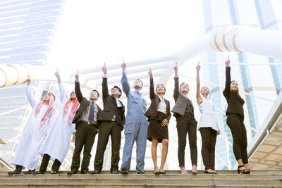 Group of people standing against the wall