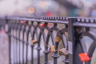 Close-up of padlocks attached to railing