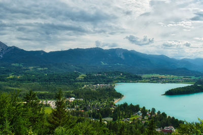 Scenic view of lake and mountains against sky