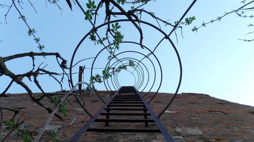 Low angle view of stairs against clear sky