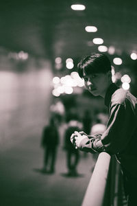 Side view of young man looking at night