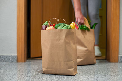 Midsection of woman holding gift