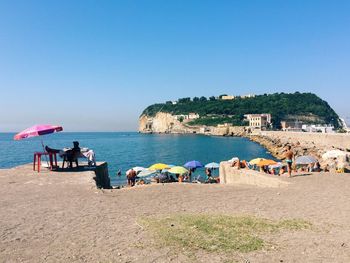 View of beach against clear sky