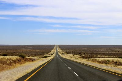 Road amidst landscape against sky