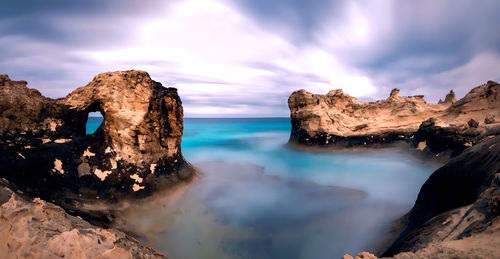 Panoramic view of rock formations against sky