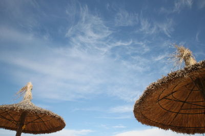 Low angle view of traditional windmill against sky