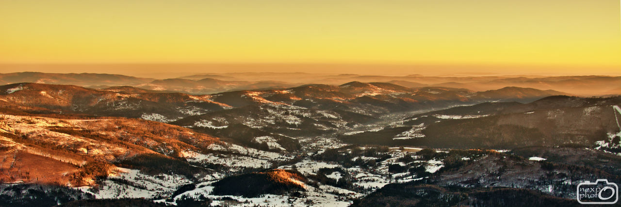 AERIAL VIEW OF CITYSCAPE AGAINST SKY DURING WINTER