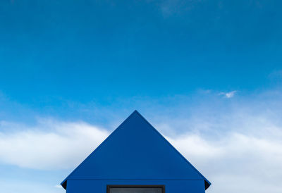 Low angle view of built structure against blue sky