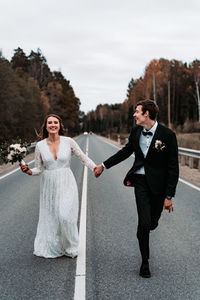 Full length of a smiling young woman