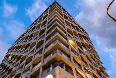 Low angle view of skyscraper against sky