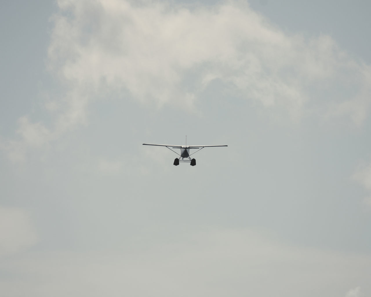 LOW ANGLE VIEW OF AIRSHOW AGAINST SKY