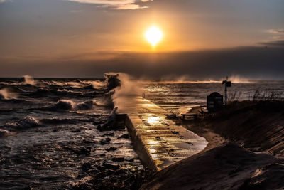 Scenic view of sea against sky during sunset