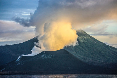 Scenic view of volcanic mountain against sky