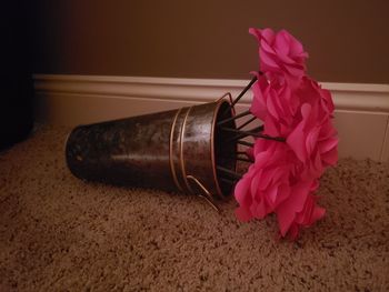 Close-up of pink flower on table