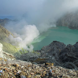 Smoke emitting from volcanic mountain