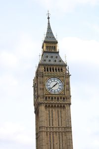 Low angle view of clock tower against sky