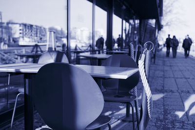 Empty chairs and tables in cafe