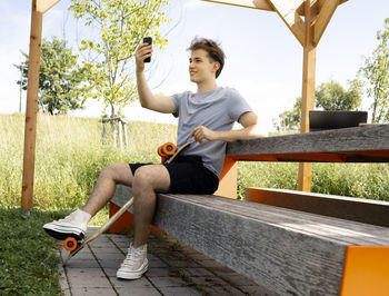 Full length of young woman exercising in park