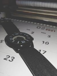 High angle view of clock on table