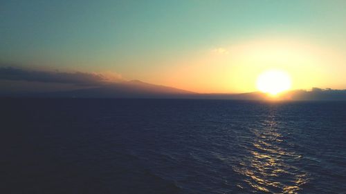 Scenic view of sea at sunset