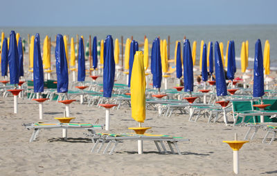 Row of chairs on beach