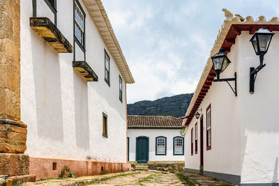 Cobblestone street in the historic city of tiradentes, minas gerais among old colonial style houses