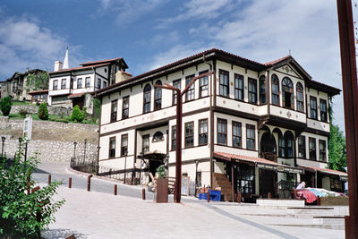 Building by street against sky