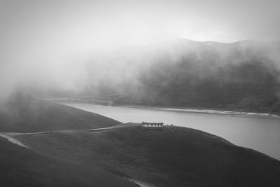 Scenic view of mountains in foggy weather