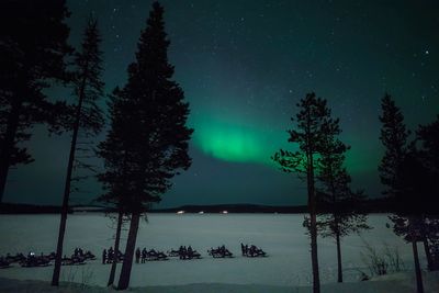 Aurora borealis over frozen lake