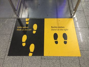 High angle view of information sign on floor at frankfurt international airport