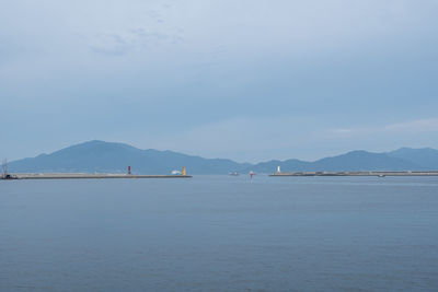 Yeosu ocean coastal view with lighthouses and various montains in the distance. yeosu, south korea