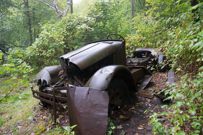 Abandoned car on field