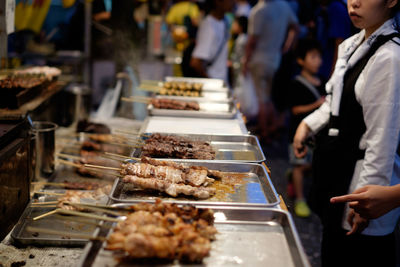 Close-up of food in trays at market stall