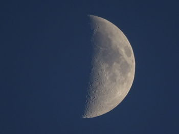 Low angle view of moon against clear sky at night