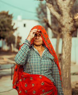 Portrait of an indian rural woman standing outdoors