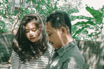 Portrait of couple kissing outdoors