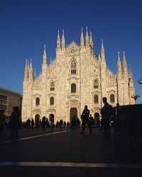 Group of people in front of building