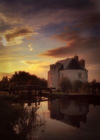 Scenic view of river at sunset