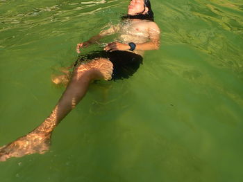 High angle view of man swimming in sea