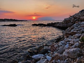 Scenic view of sea against sky during sunset