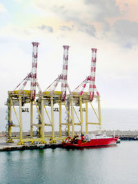 Cranes and boat at commercial dock