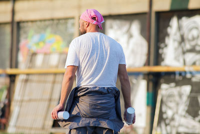 Rear view of man wearing hat