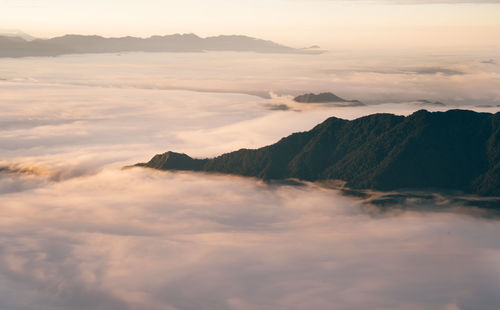 Scenic view of mountains against sky during sunset