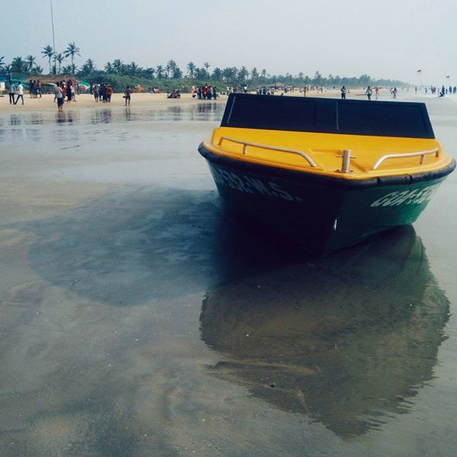 water, sea, nautical vessel, beach, transportation, boat, waterfront, shore, mode of transport, incidental people, nature, sand, scenics, tranquility, beauty in nature, tranquil scene, moored, sky, outdoors, travel