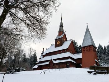 Building against sky during winter