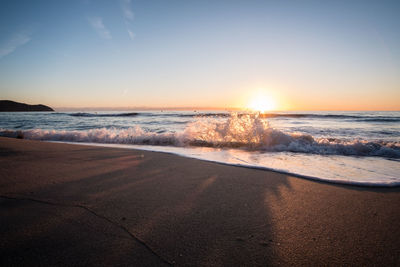 Scenic view of sea against sky during sunset