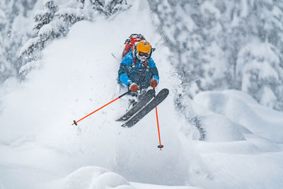 Freeride skier captured mid air in the backcountry, werfenweng, austria.