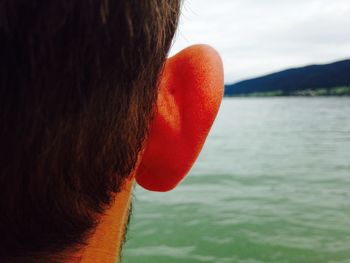 Close-up of red object against sky