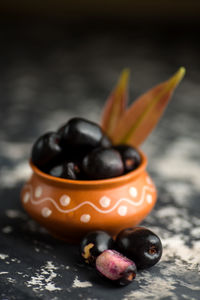 Close-up of orange fruits in bowl on table