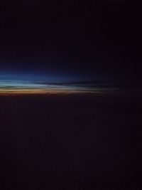 Scenic view of sea against clear sky during sunset